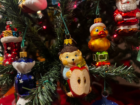 Beautiful festive glass decorations on the Christmas tree. Close-up. Beautiful Christmas background. The concept of decorations and decor for the new year. New Year card 2024. High quality photoの写真素材