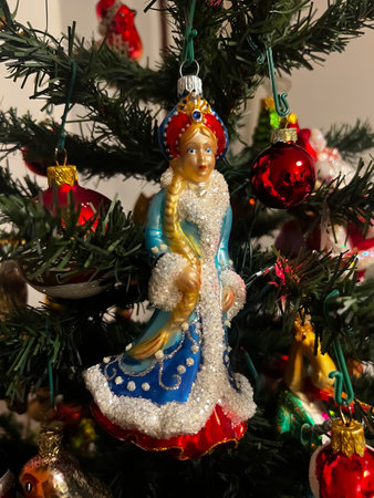Beautiful festive glass decorations on the Christmas tree. Close-up. Beautiful Christmas background. The concept of decorations and decor for the new year. New Year card 2024. High quality photoの写真素材