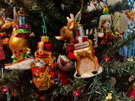 Beautiful festive glass decorations on the Christmas tree. Close-up. Beautiful Christmas background. The concept of decorations and decor for the new year. New Year card 2024. High quality photoの写真素材
