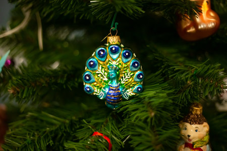 Decorating Christmas tree, close up, copy space. Merry Christmas and Happy New Year. Women hands decorate the Christmas tree with balls and toys.の写真素材