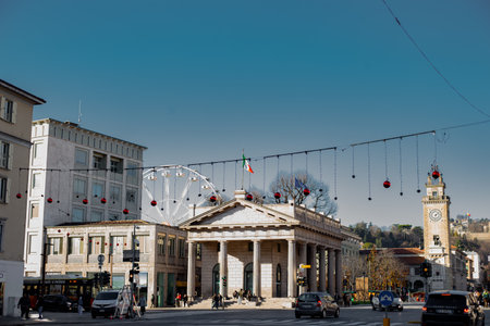 Bergamo, Italy,December 19, 2023 Christmas market and Ferris wheel Mercatini di Natale e ruota panoramica in Bergamo. Christmas streets of Bergamo