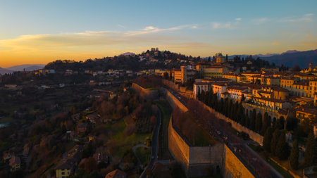 Citta Alta - Bergamo, Italy. Drone aerial view of the old town during sunrise. Landscape at the city center, its historical buildings. High quality photoの写真素材