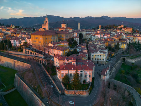Citta Alta - Bergamo, Italy. Drone aerial view of the old town during sunrise. Landscape at the city center, its historical buildings. High quality photoの写真素材
