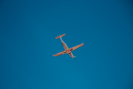 Beautiful Panoramic Background with flying plane in blue sky. Passenger airplane takes off in sky. Travel concept. Wide Angle Wallpaper or Web banner With Copy Space. Italia, Milano 14.12.2023の写真素材