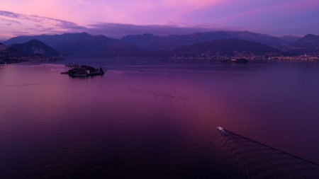 Beautiful sunset on Lago Maggiore. Drone view of the island Bella. Borromean islands Isola Bella and Isola dei Pescatori. Italy, Stresa, Lake Maggiore. 3.01.2024の写真素材