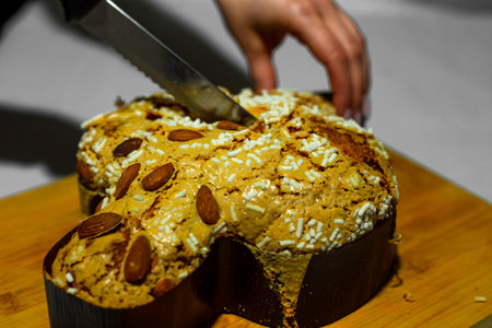 Traditional Italian desserts for Easter - Easter dove. Festive pastries with almonds and sugar icing. Easter decorの写真素材