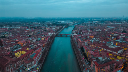Aerial view of Verona at sunset, Veneto region, Italia. Red tiled roofs. Traditional Italian...