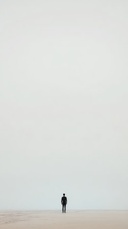 Silhouette of a man standing in the middle of the desertの素材