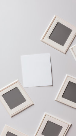 Photo frame on white background. Flat lay, top view, copy space.の素材