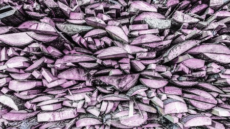 Crushed wood. Firewood stacked on each other in rows. Front view, close-up, background