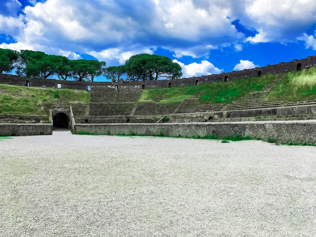 Ancient Roman city of Pompeii under a blue sky with cloudsの写真素材