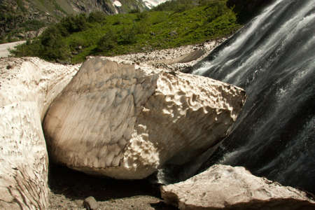 Waterfalls and glaciers and green valleys. Exotic picture - ice, water, forest, summer in one paletteの写真素材