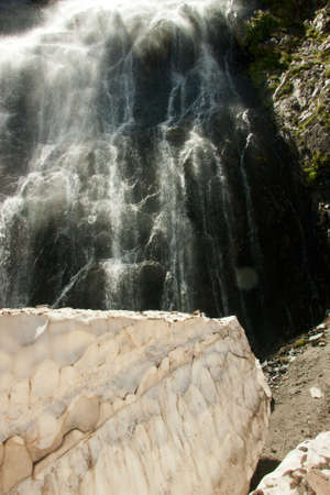 Waterfalls and glaciers and green valleys. Exotic picture - ice, water, forest, summer in one paletteの写真素材