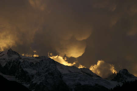 Mammatus Clouds, red sunset in the mountainsの写真素材