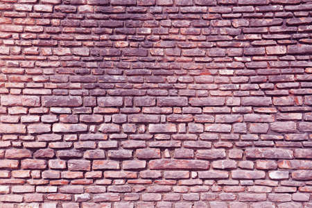 The city wall of stone in violet tint
