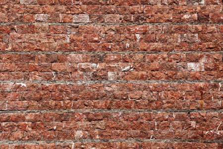 Wall of stone in red tintの写真素材