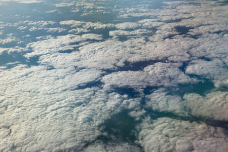 view from window of a jet plane wing with beautiful weatherの写真素材