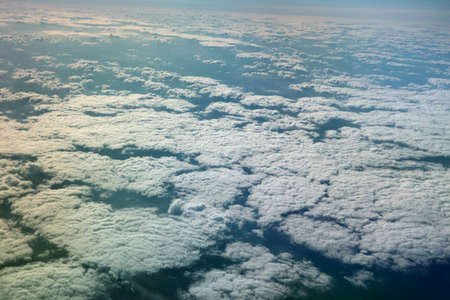 view from window of a jet plane wing with beautiful weatherの写真素材
