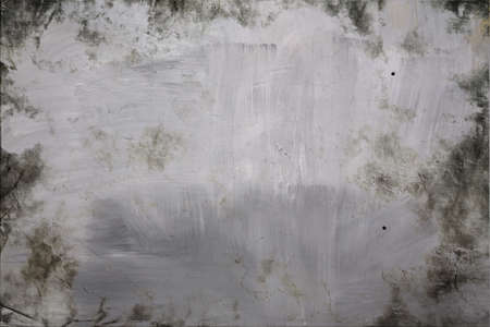 Abstract mottled grunge background texture with spotty pattern wall, old colored rough wall backgroundの写真素材