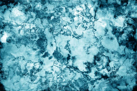 Abstract mottled grunge background texture with spotty pattern wallの写真素材