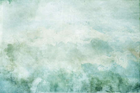 Abstract mottled grunge background texture with spotty pattern wallの写真素材
