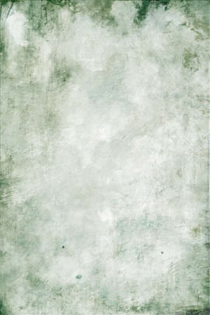 Abstract mottled grunge background texture with spotty pattern wallの写真素材