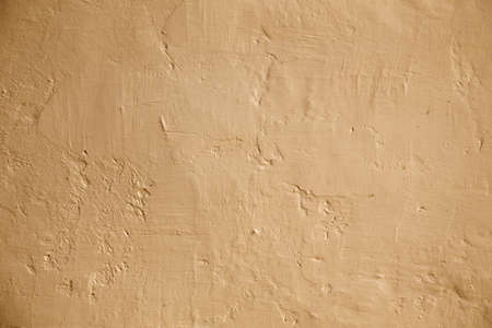 Grunge background beige wall whitewash lime plaster