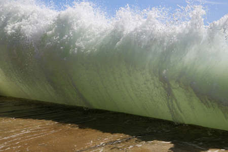 Smash the wave into a concrete pierの写真素材