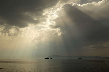 Cloudy seascape with clouds and sun rays