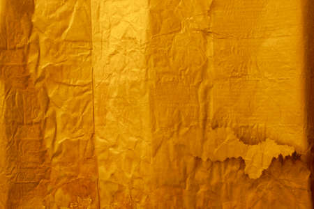 crumpled paper texture, background colored cardboard with a coarse specklesの写真素材