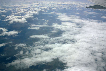 View from window of a jet plane wing with beautiful weatherの写真素材
