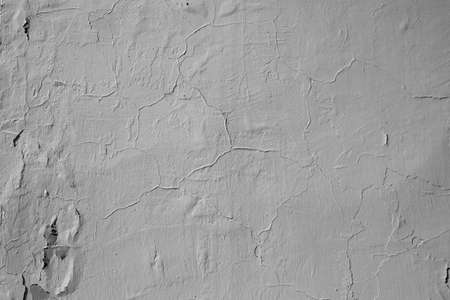 white lime, plastered walls with cracks and irregularitiesの写真素材