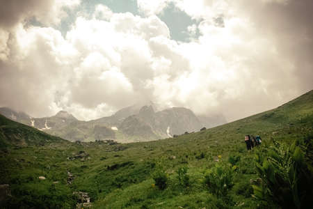 Mountain landscape with clouds. Peaks and valleys in the summer seasonの写真素材