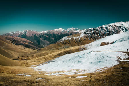 The mountain autumn landscape with colorful forest and high peaks Caucasus Mountainsの写真素材
