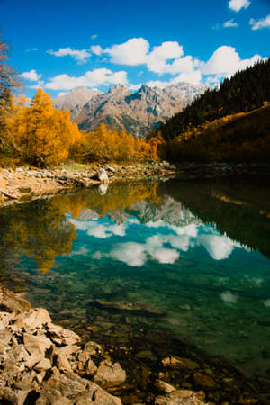 Scenery of high mountain with lake and high peak on a clear day. Pure mountain water. Clear mountain...