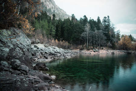 Scenery of high mountain with lake and high peak on a clear dayの写真素材