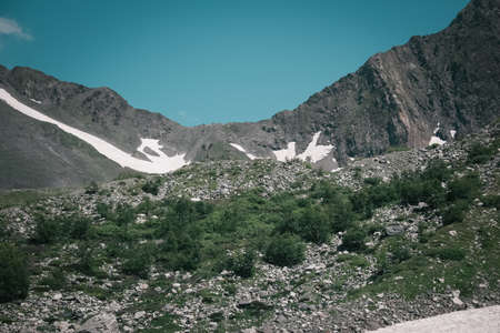 Mountain landscape with clouds. Peaks and valleys in the summer seasonの写真素材