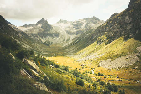 The mountain autumn landscape with colorful forest and high peaks Caucasus Mountainsの写真素材