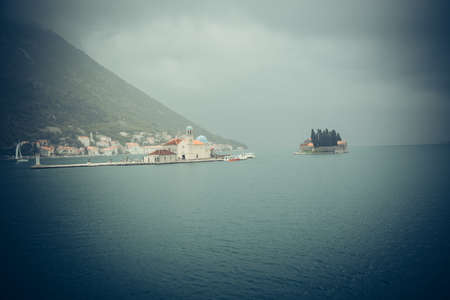 Ancient walls old town Boka Kotorska on the Adriatic Sea, Mediterranean Sea, Montenegro, Europe. Boka Kotorska - the medieval cities of the Venetian style in the Mediterraneanの写真素材