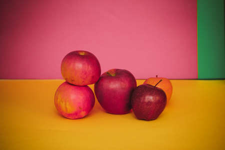 red apples on a colored background.の写真素材