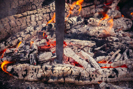 Large pot over a campfire cooking in cast-iron cauldron in nature.の写真素材