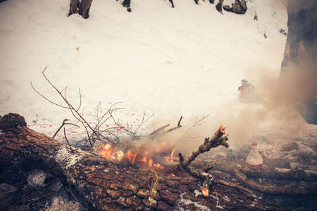 Refuse disposal in a fire in nature, cleaning and waste incineration after the picnicの写真素材