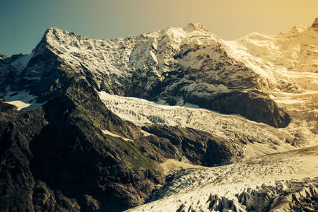 Mountain Valley, Alpine landscape areas. Panoramic view of mountains, trees, glacier.の写真素材