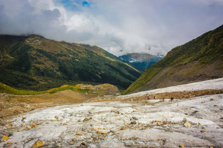 Mountain Valley, Alpine landscape areas. Panoramic view of mountains, trees, glacier.の写真素材