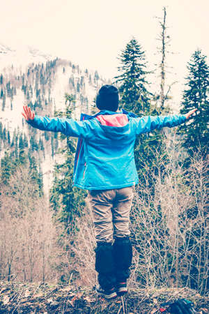 Cheerful woman traveler on vacation summer vacations outdoor. Forest in the highlands. Hiking Travel...
