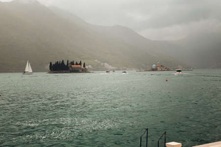 City Perast on coast of Boka Kotor bay, Montenegro, Adriatic Sea, Mediterranean Sea.の写真素材