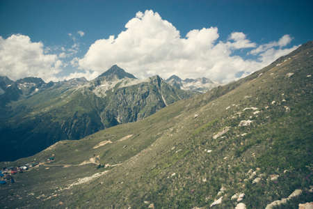 Mountain summer landscape with forest and high peaks. Caucasus. A view of the main Caucasian ridge. Biosphere Reserve resort Dombay. The concept of travel and tourism.の写真素材