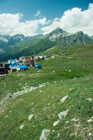 Mountain summer landscape with forest and high peaks. Caucasus. A view of the main Caucasian ridge. Biosphere Reserve resort Dombay. The concept of travel and tourism.の写真素材