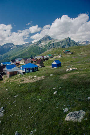 Mountain summer landscape with forest and high peaks. Caucasus. A view of the main Caucasian ridge. Biosphere Reserve resort Dombay. The concept of travel and tourism.の写真素材