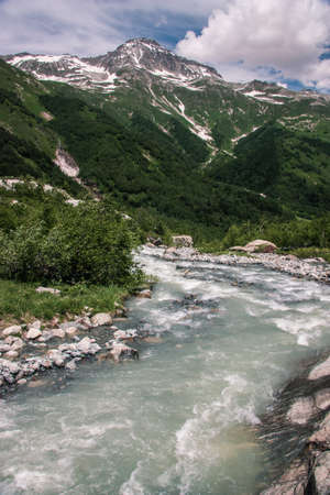 Mountain Valley a top view of the river bed. Landscape with a mountain river. Landscape with mountains trees and a riverの写真素材